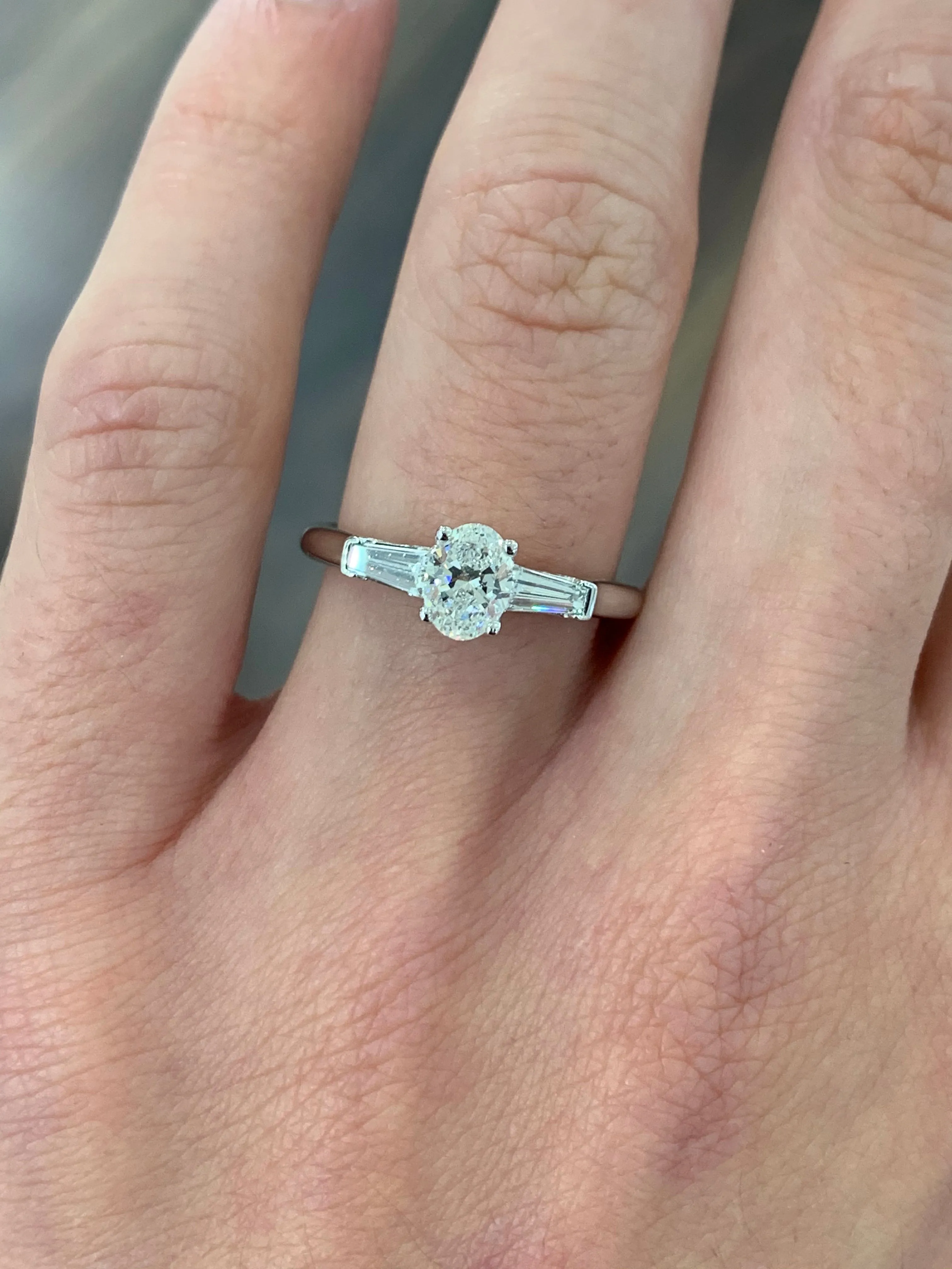 Platinum GIA Oval Diamond Engagement Ring with Baguette Side Stones